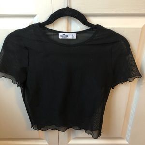 Sheer black shirt with tank top underneath